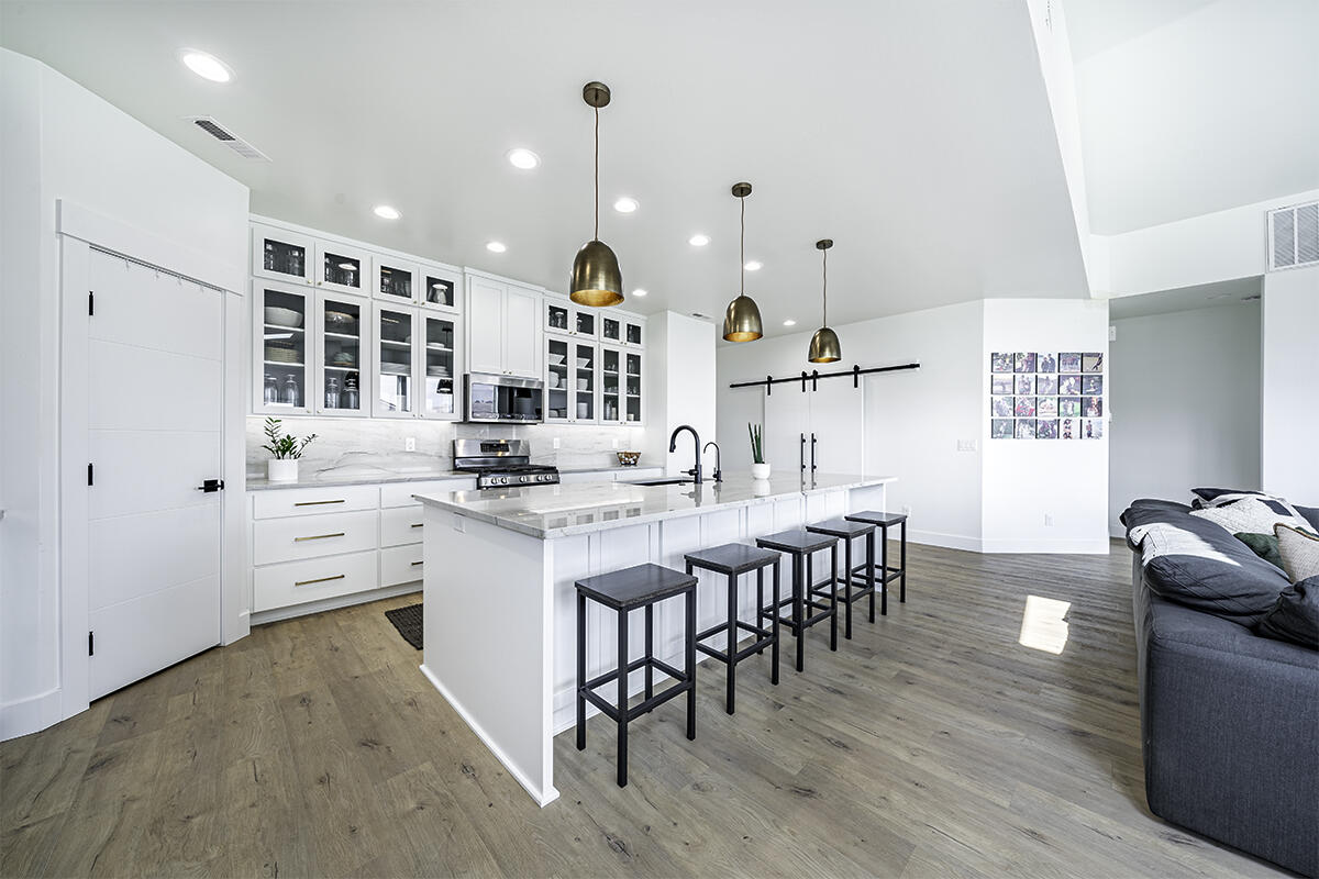 157 Autumn Ridge Court Talent, OR 97540 - Photo 15 of 55 a kitchen with counter space dining table and chairs