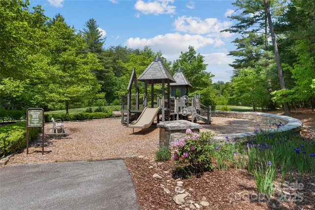 a view of a table and chairs under an umbrella