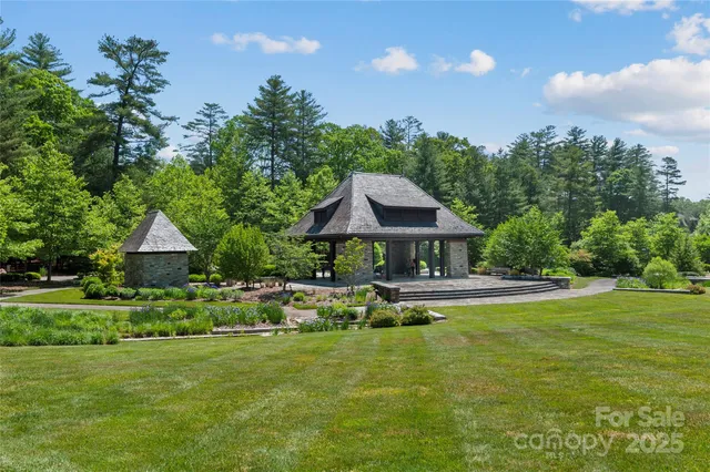 a balcony with wooden floor and lake view