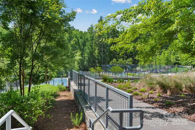 a view of a chair and tables in the balcony
