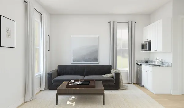 a living room with furniture and white appliances