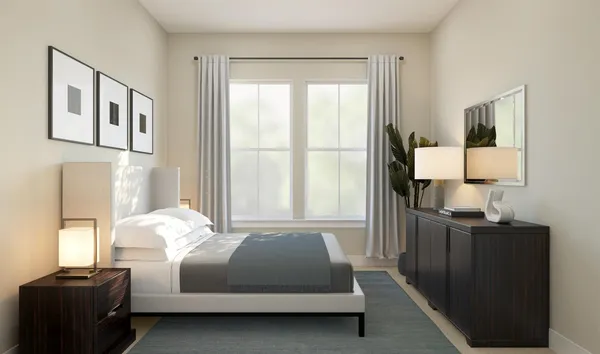 a bedroom with a bed window and a lamp