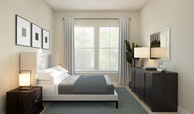 a bedroom with a bed window and a lamp