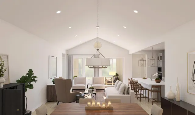 a living room with furniture a window and dining table