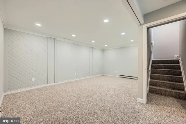 a view of an empty room with stairs