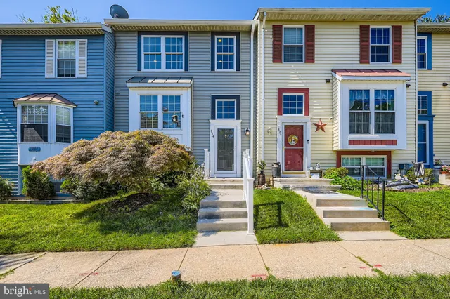 a view of a brick building next to a yard