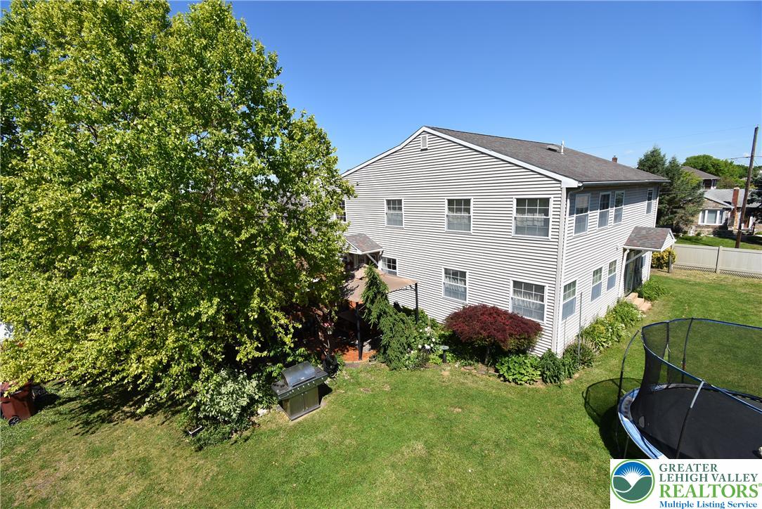 424 Grape Street Whitehall, PA 18052 - Photo 52 of 56 A classic two-story residence with a spacious backyard, perfect for outdoor activities.