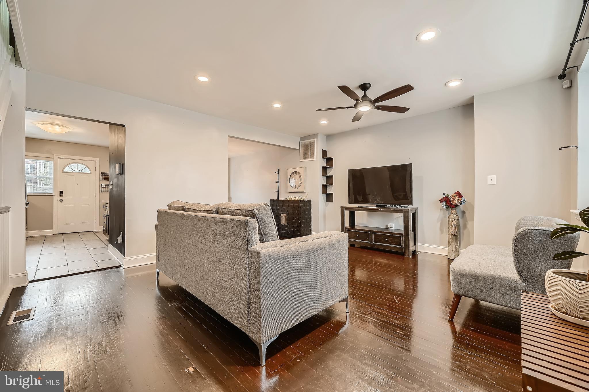 3828 Ednor Road Baltimore, MD 21218 - Photo 1 of 27 a living room with furniture and a flat screen tv