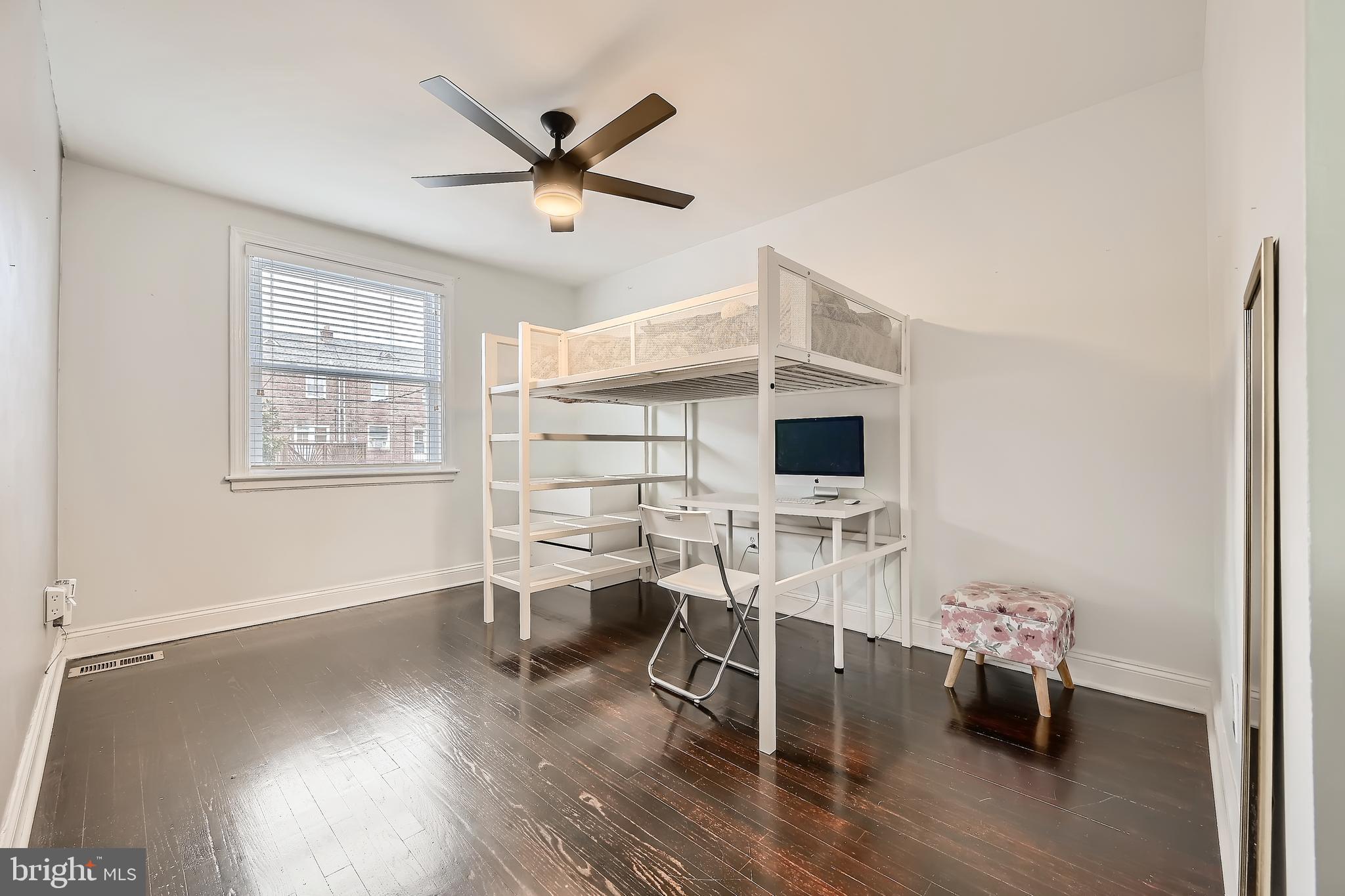 3828 Ednor Road Baltimore, MD 21218 - Photo 20 of 27 a living room with furniture and a wooden floor