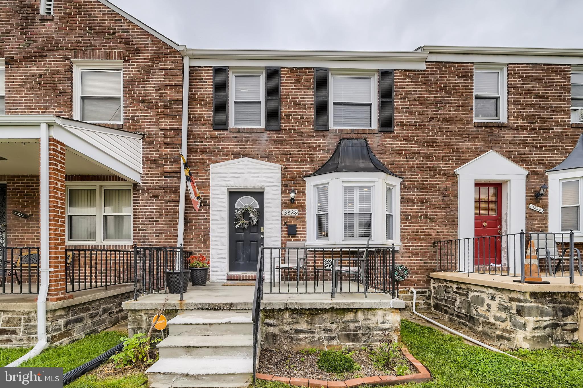 3828 Ednor Road Baltimore, MD 21218 - Photo 2 of 27 front view of a house with a yard