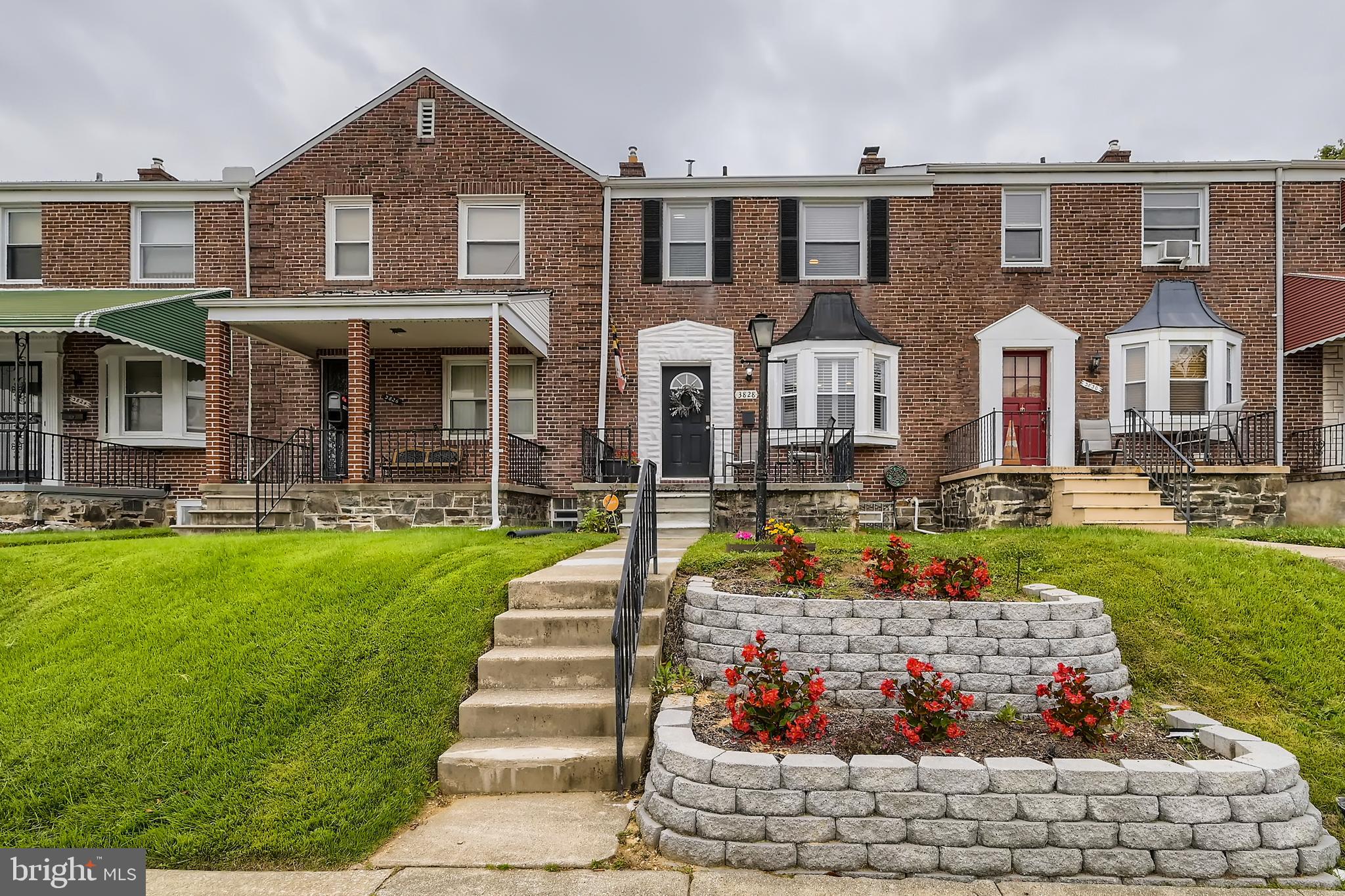 3828 Ednor Road Baltimore, MD 21218 - Photo 25 of 27 a front view of a house with a yard outdoor seating and garden