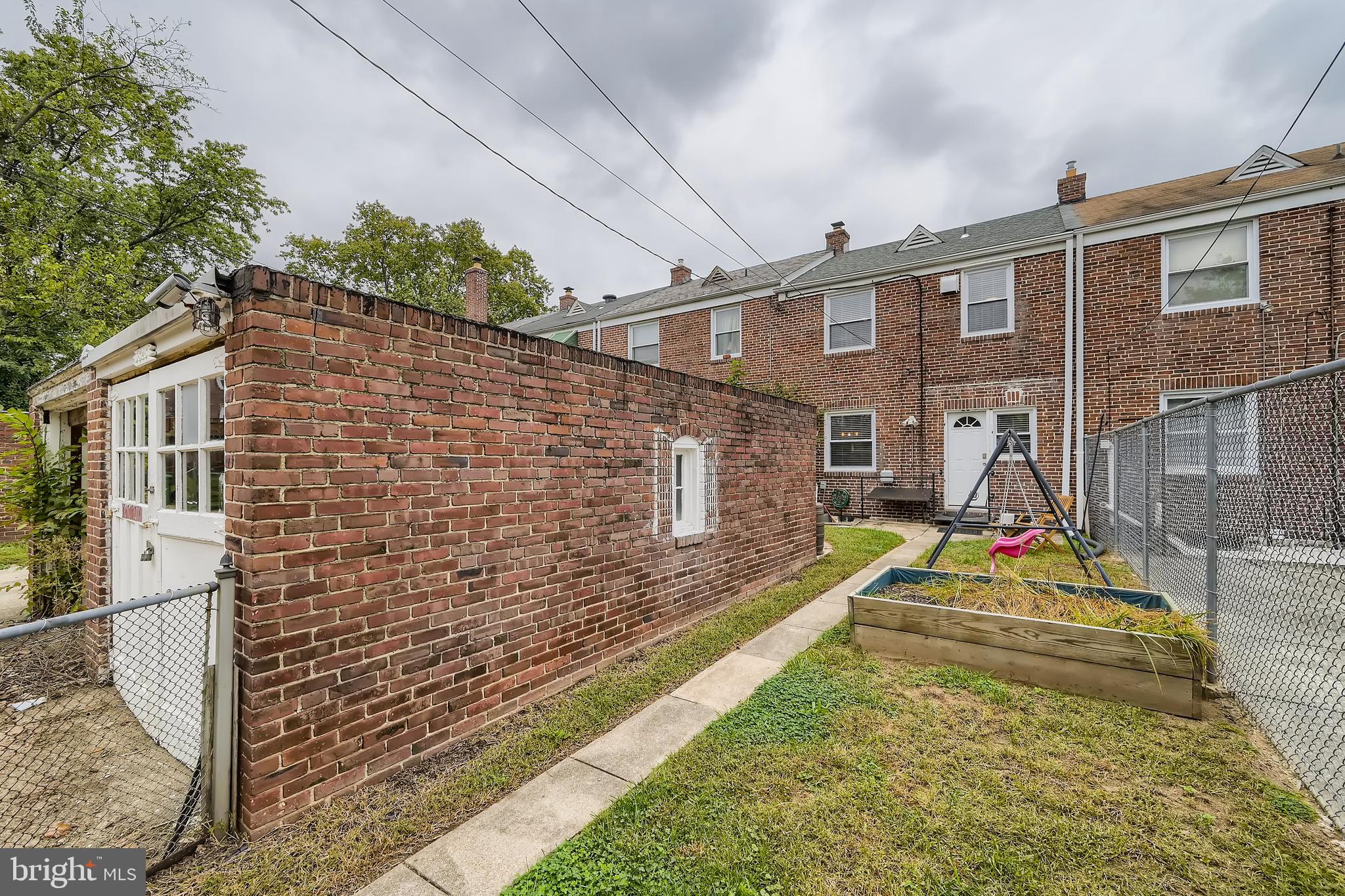 3828 Ednor Road Baltimore, MD 21218 - Photo 27 of 27 a view of residential houses with wooden deck