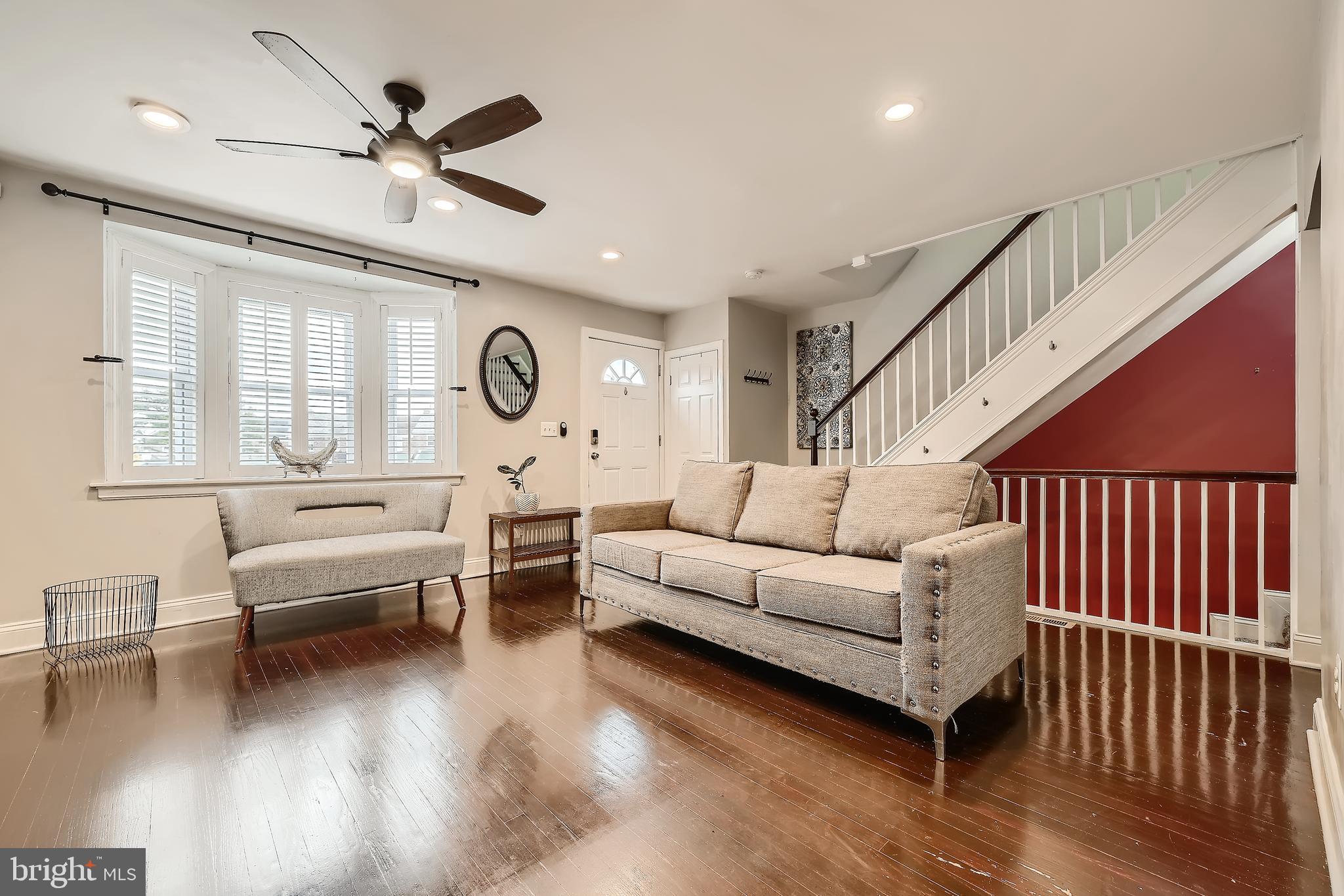 3828 Ednor Road Baltimore, MD 21218 - Photo 7 of 27 a living room with furniture and a large window