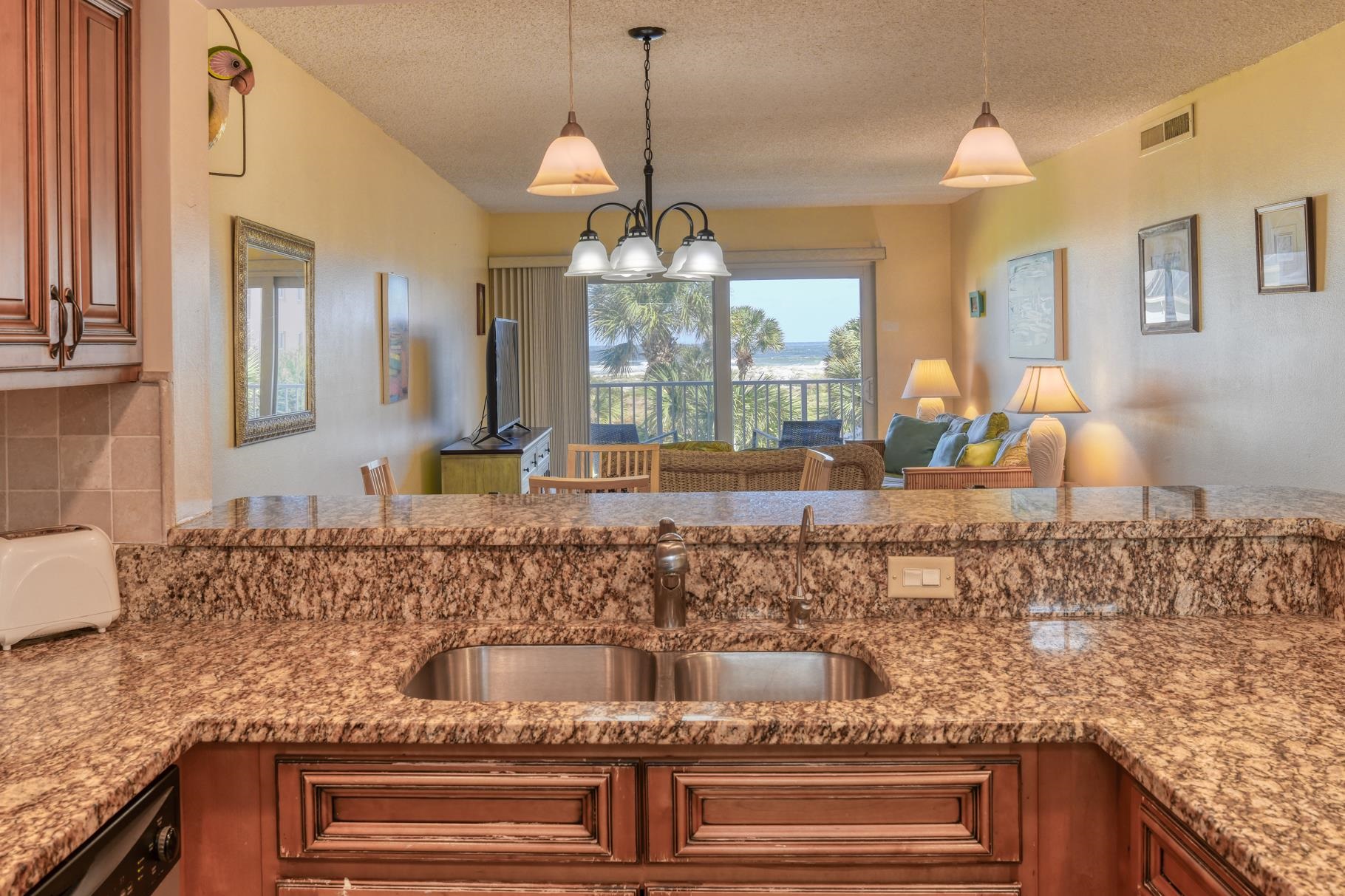 4 Ocean Trace Road, Unit 323 St. Augustine Beach, FL 32080 - Photo 5 of 37 a bathroom with a granite countertop sink and a mirror
