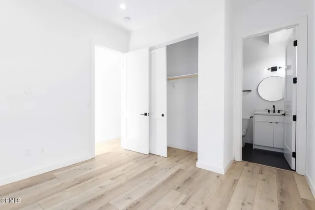 a view of a room with wooden floor