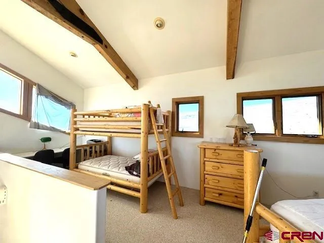 a bathroom with a granite countertop sink toilet a mirror and shower
