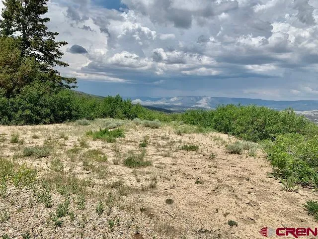 a view of a lake in between two of buildings