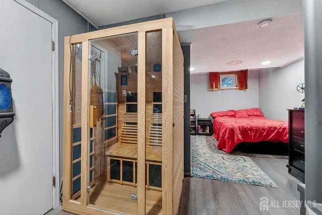 a bedroom with furniture and a walk in closet