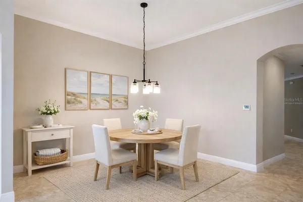 a bedroom with a bed and a chandelier fan