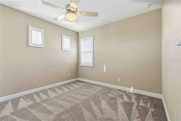 a view of a hallway with wooden floor and entryway