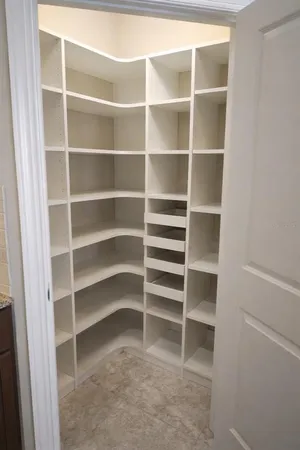 a aerial view of a house with a garden and lake view