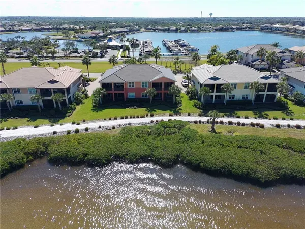a view of a swimming pool with outdoor seating