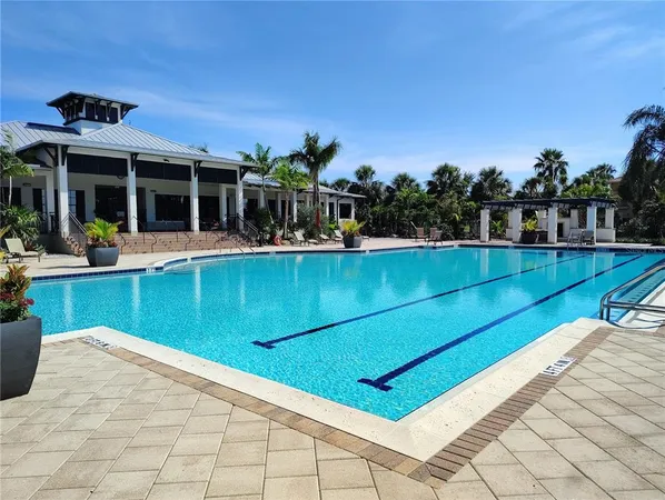 a view of a balcony with wooden floor and outdoor seating