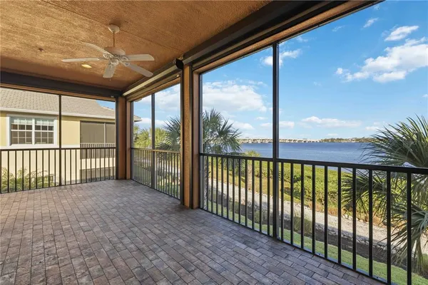 a balcony with furniture and wooden floor