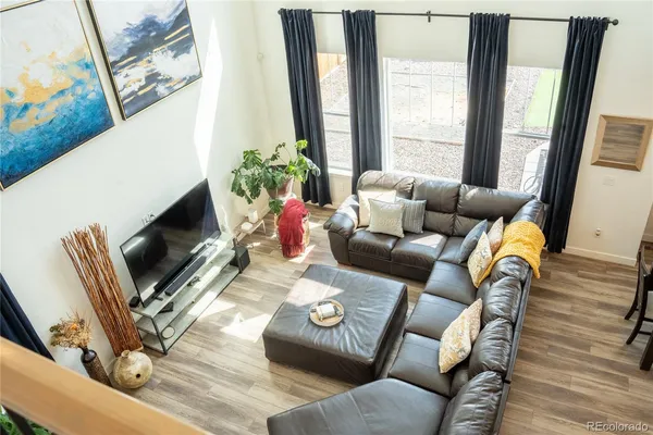 a living room with furniture fireplace and a flat screen tv