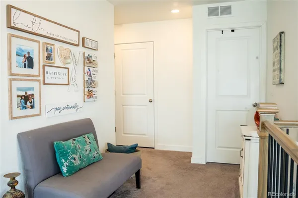 a living room with furniture and a gate