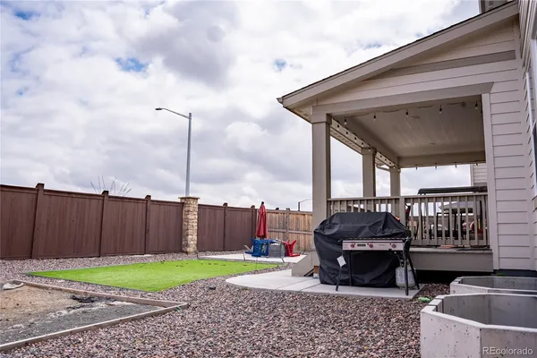 a view of a chairs and table in the patio