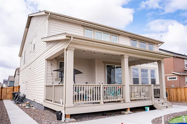 a view of a house with a wooden deck