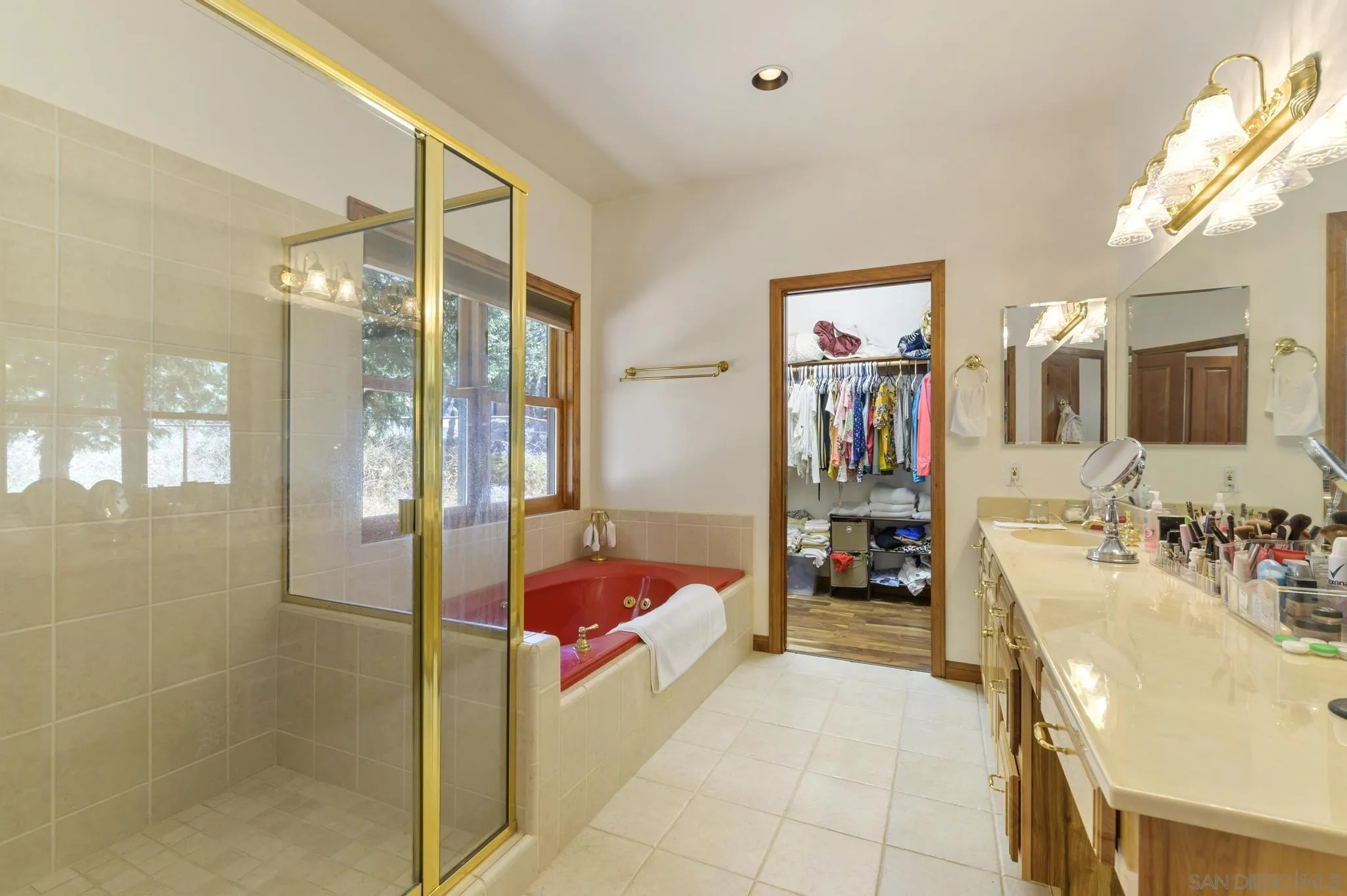 34610 Apache Drive Julian, CA 92036 - Photo 13 of 23 a spacious bedroom with a bed and a large mirror