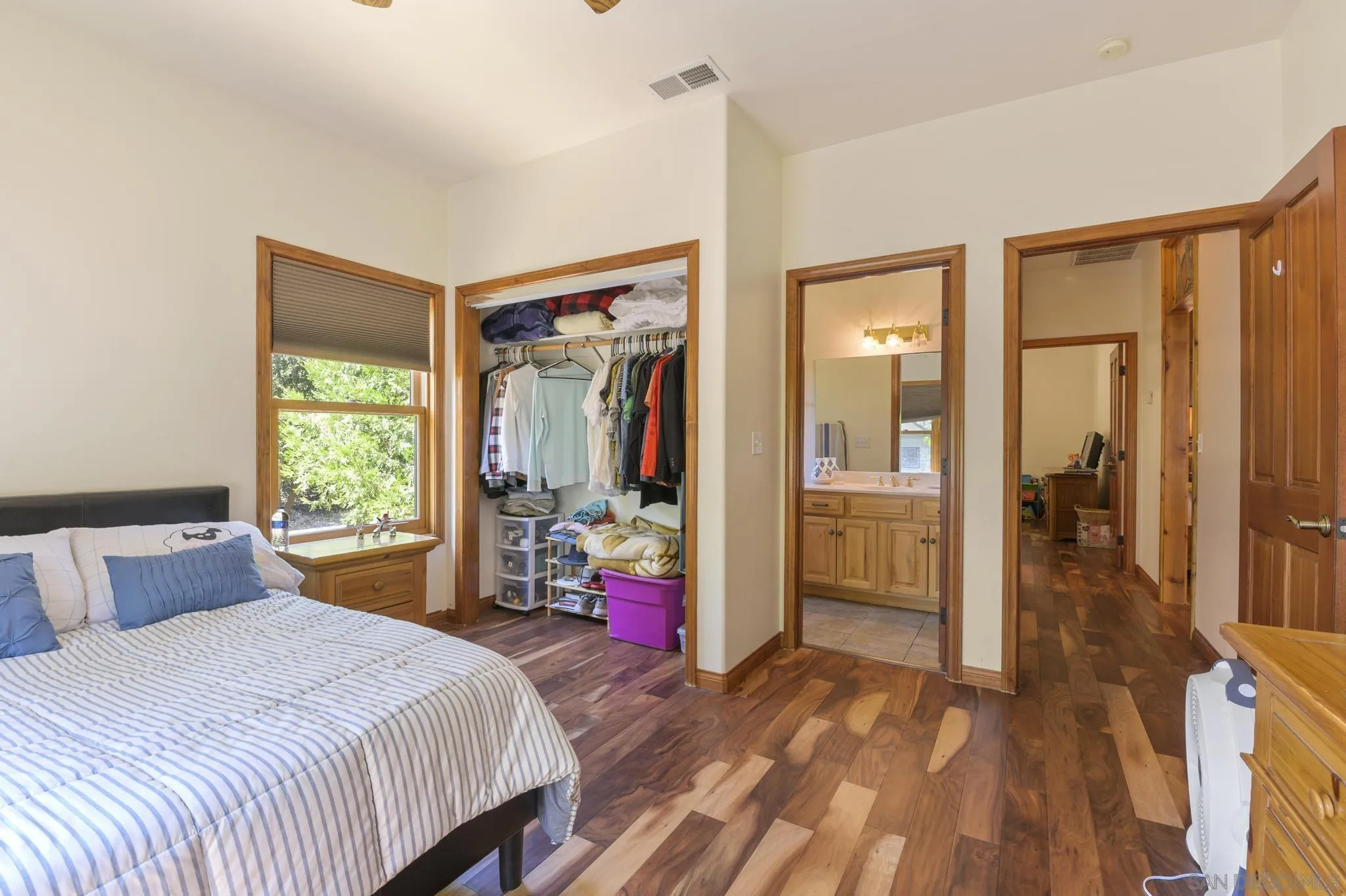 34610 Apache Drive Julian, CA 92036 - Photo 15 of 23 a bedroom with a bed and a wooden floor