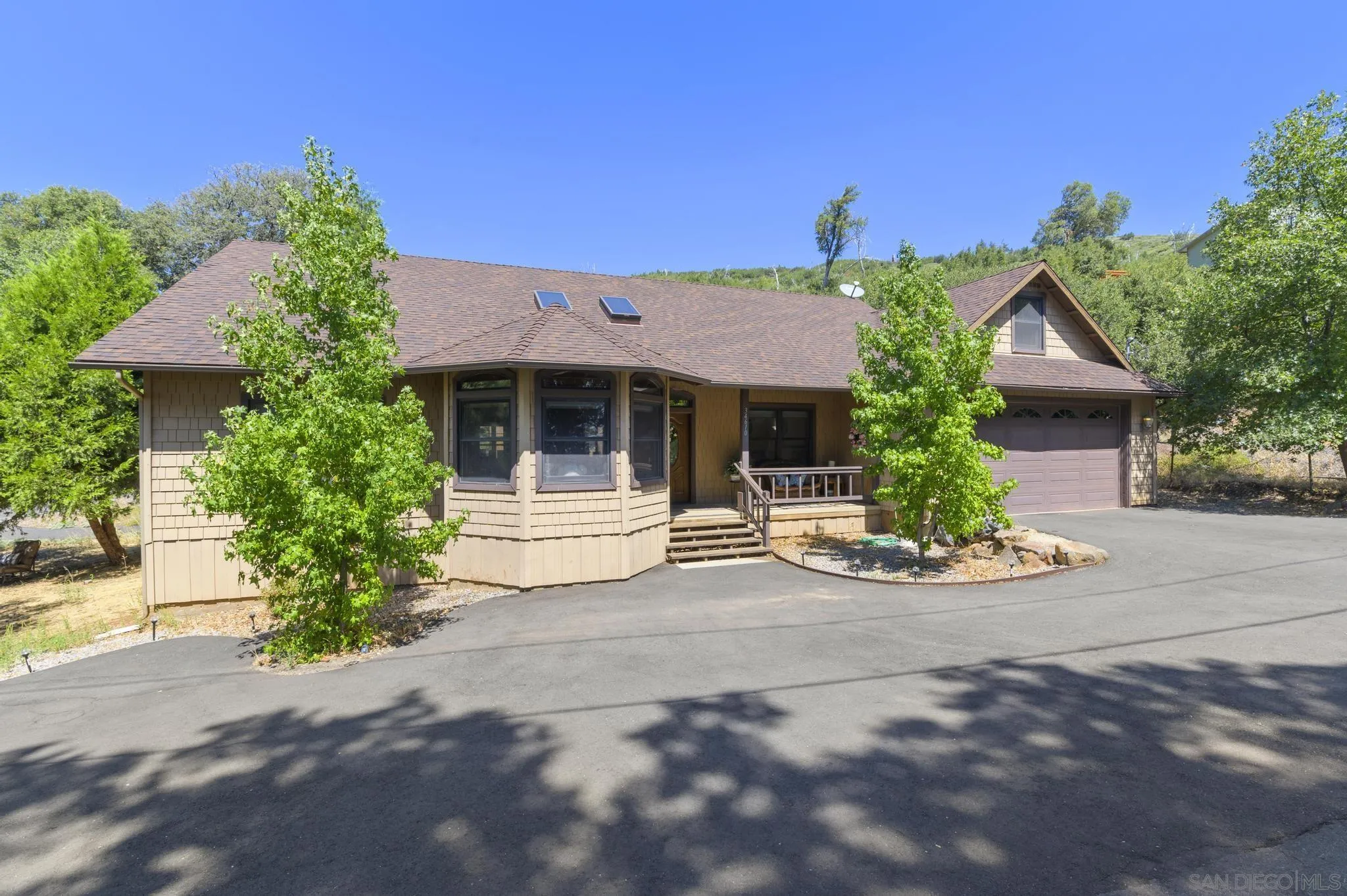 34610 Apache Drive Julian, CA 92036 - Photo 2 of 23 a front view of a house with garden