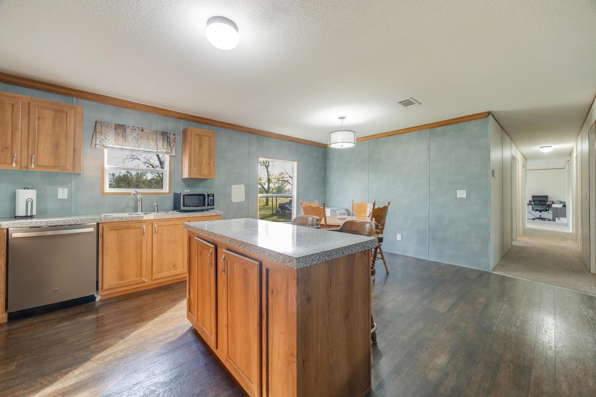 960 State Line Road DeFuniak Springs, FL 32433 - Photo 12 of 51 a kitchen with a sink and cabinets