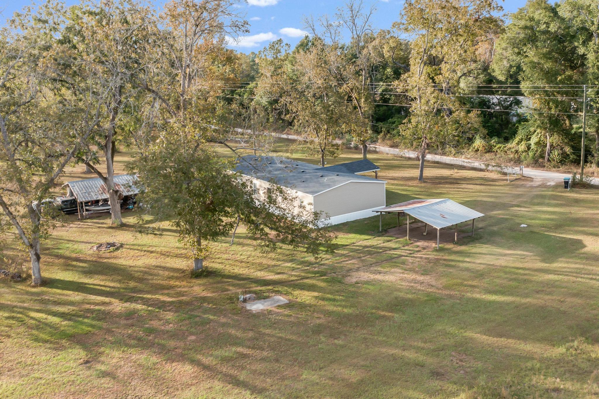 960 State Line Road DeFuniak Springs, FL 32433 - Photo 41 of 51 a view of a yard with swimming pool