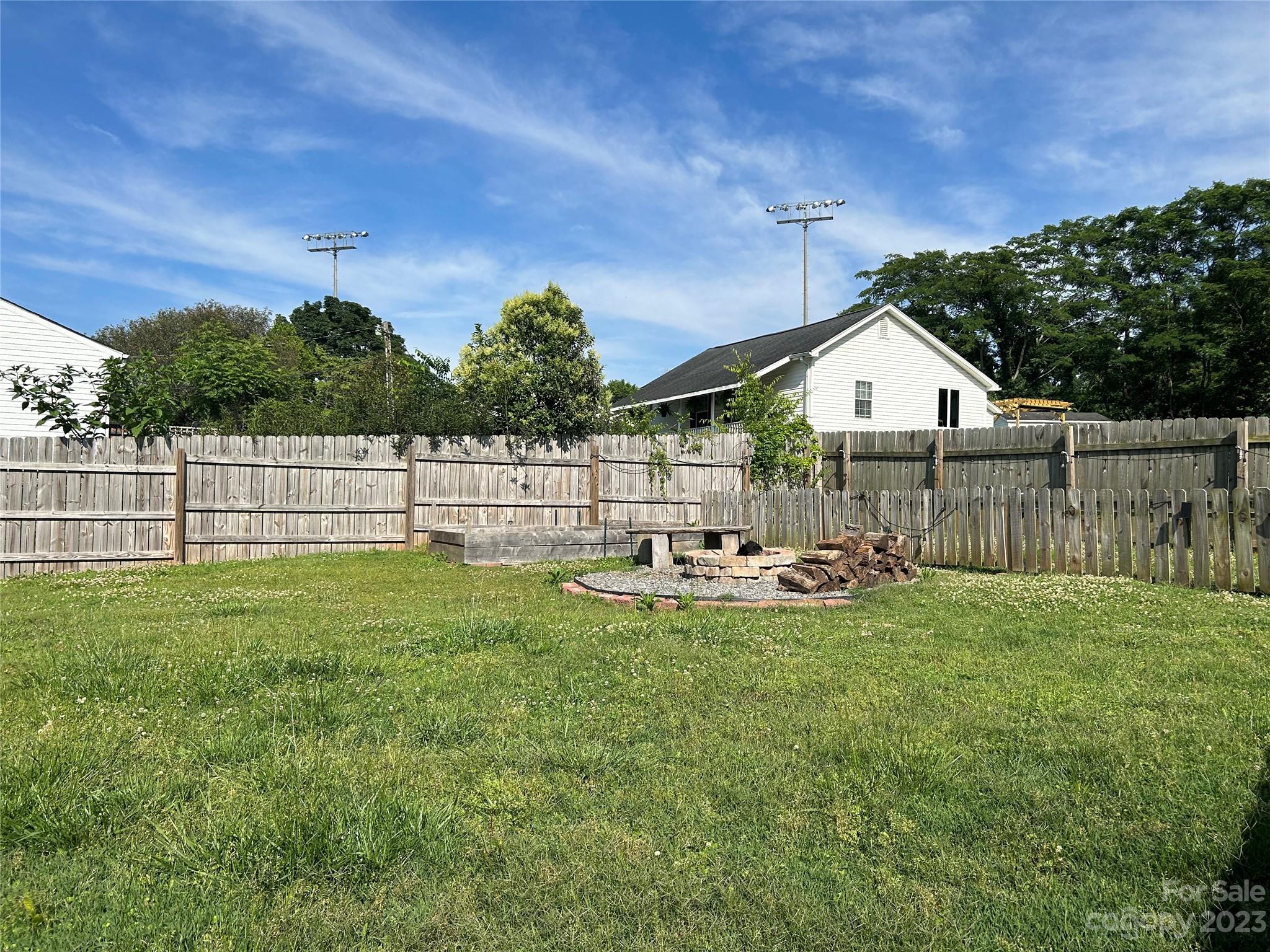 211 Calhoun Street Fort Mill, SC 29715 - Photo 13 of 13 a view of a house with backyard and sitting area