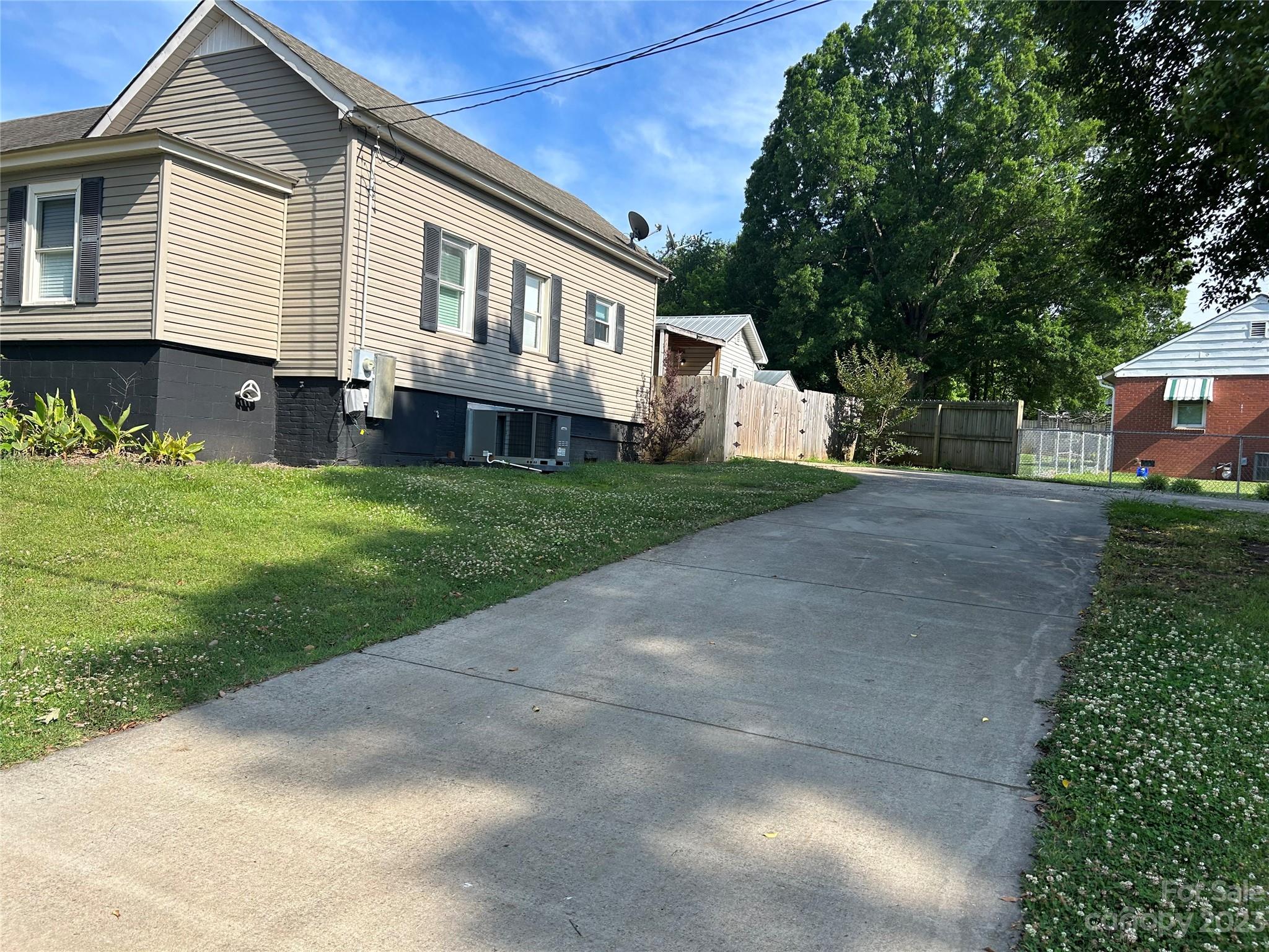 211 Calhoun Street Fort Mill, SC 29715 - Photo 2 of 13 a view of house with a yard