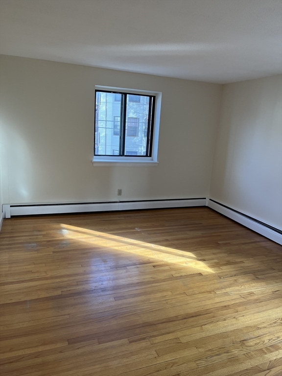 39 Linden Street, Unit 21 Boston, MA 02134 - Photo 19 of 20 a view of a room with wooden floor and window