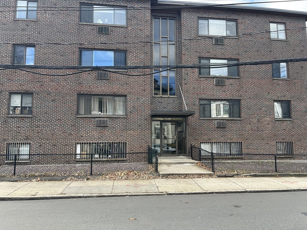 39 Linden Street, Unit 21 Boston, MA 02134 - Photo 20 of 20 a front view of a house with a yard