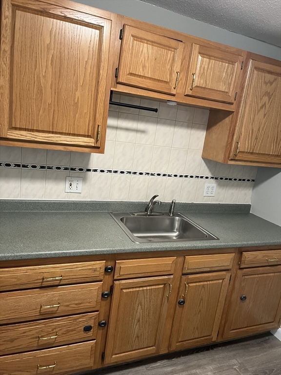 39 Linden Street, Unit 21 Boston, MA 02134 - Photo 8 of 20 a close view of sink and cabinets
