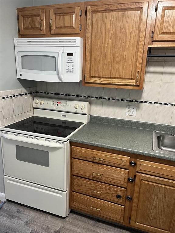 39 Linden Street, Unit 21 Boston, MA 02134 - Photo 9 of 20 a stove top oven sitting inside of a kitchen