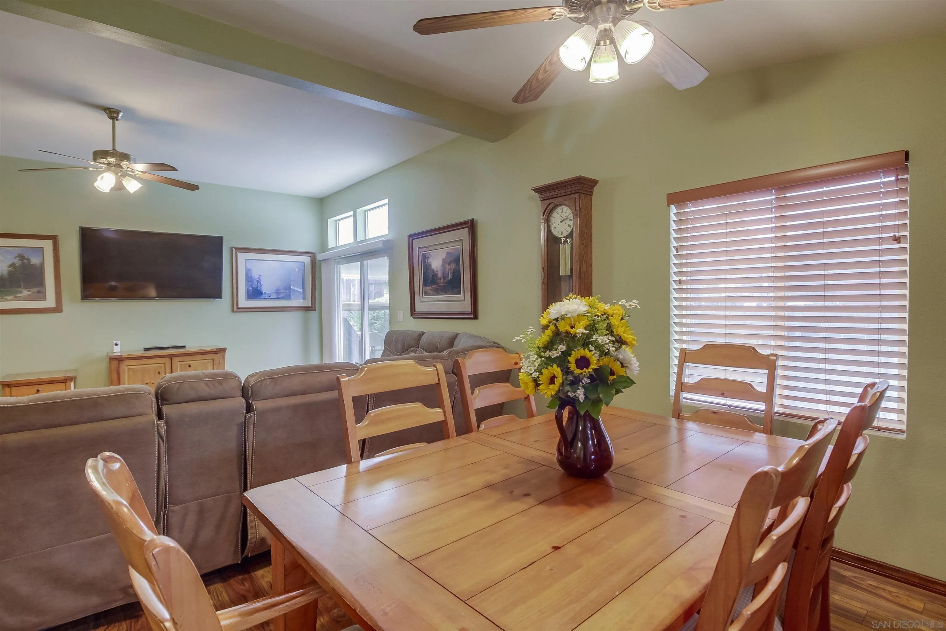 15935 Spring Oaks Road El Cajon, CA 92021 - Photo 15 of 66 a living room with furniture a chandelier and a flat screen tv