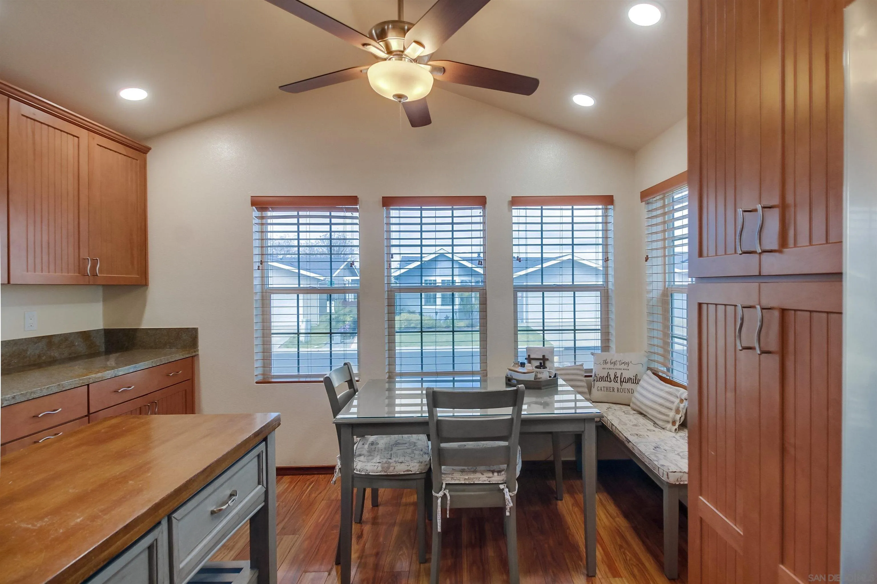 15935 Spring Oaks Road El Cajon, CA 92021 - Photo 17 of 66 a view of a dining room with furniture window and wooden floor