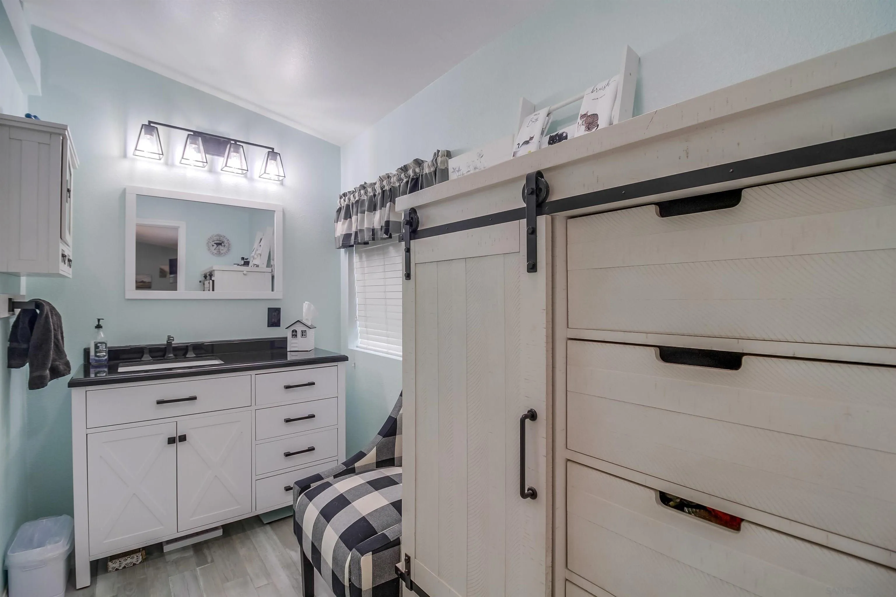 15935 Spring Oaks Road El Cajon, CA 92021 - Photo 32 of 66 a bathroom with a sink a vanity and a mirror
