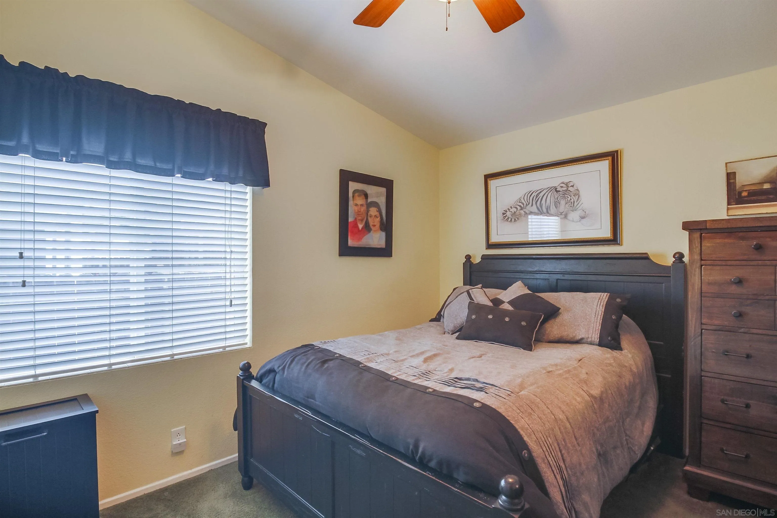 15935 Spring Oaks Road El Cajon, CA 92021 - Photo 35 of 66 a bedroom with a bed and painting on the wall