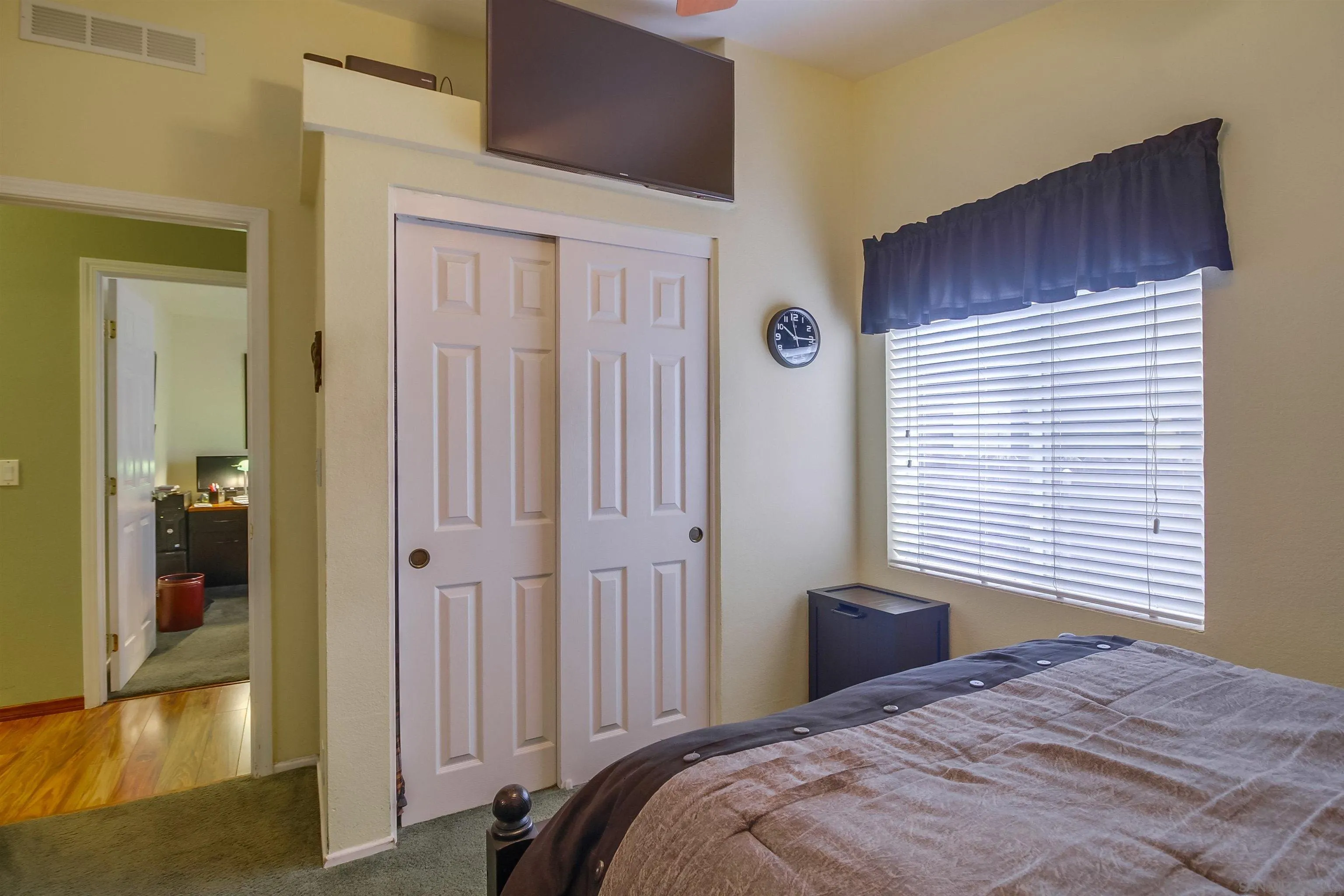 15935 Spring Oaks Road El Cajon, CA 92021 - Photo 36 of 66 a bedroom with a bed and a window