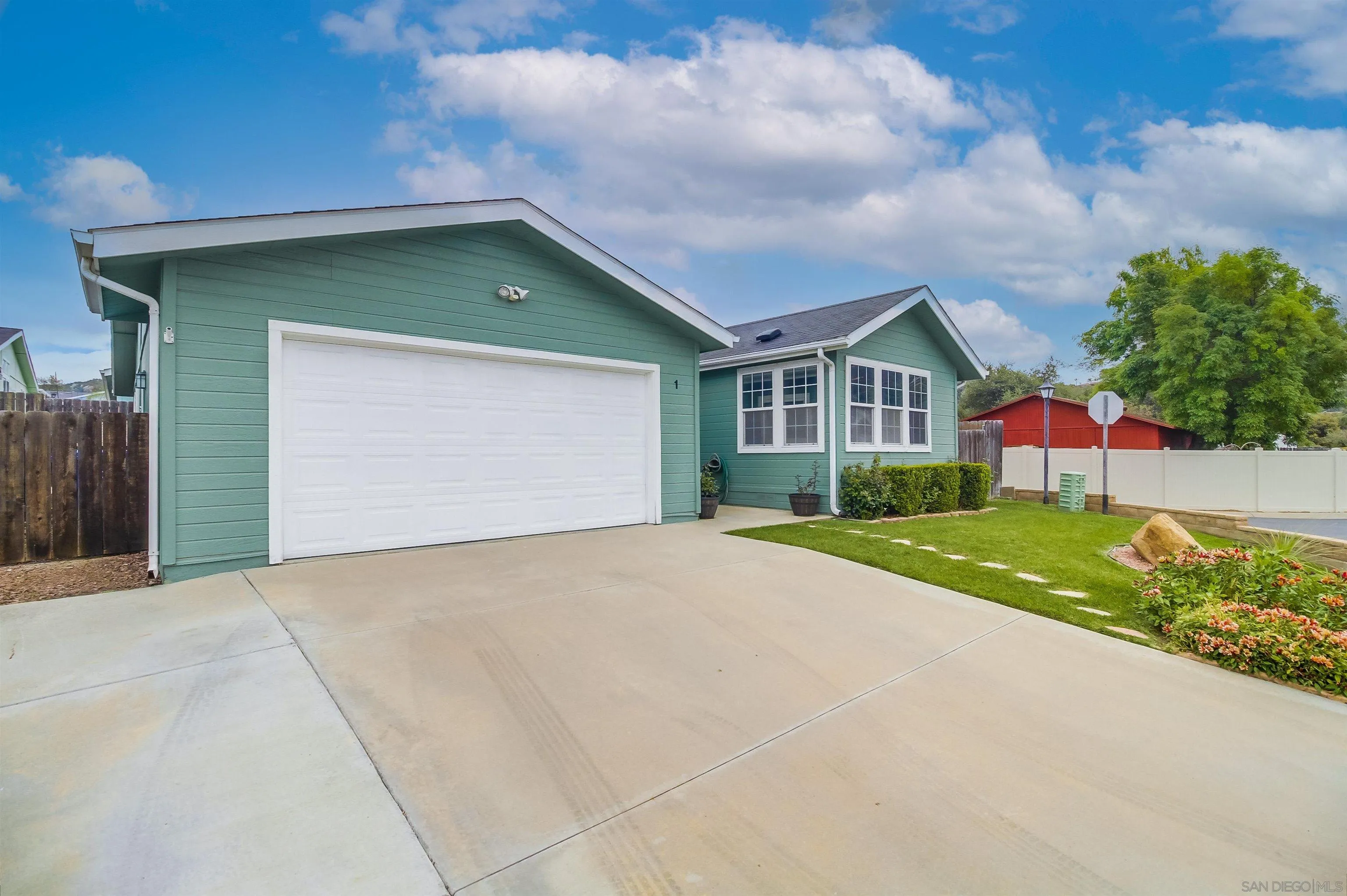 15935 Spring Oaks Road El Cajon, CA 92021 - Photo 4 of 66 a front view of house with yard and trees
