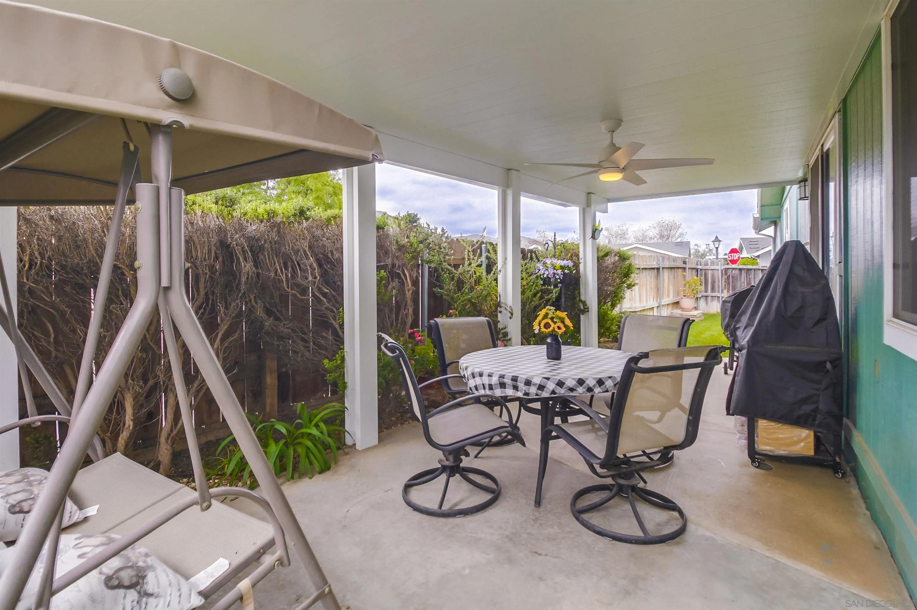 15935 Spring Oaks Road El Cajon, CA 92021 - Photo 44 of 66 a view of a dining room with furniture wooden floor and balcony